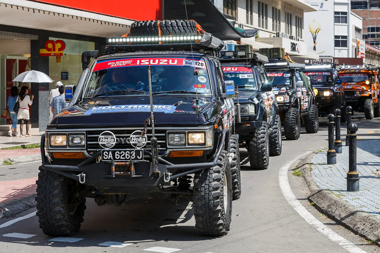 Convoy of 4x4 vehicles on a Kota Kinabalu street during the 2014 Borneo Safari