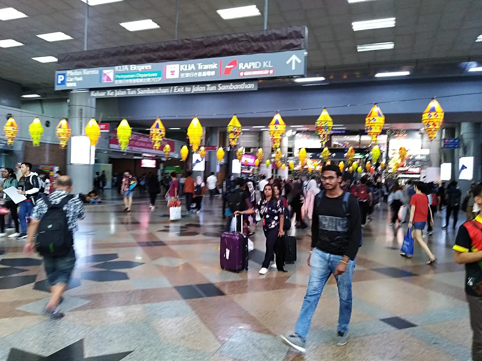 Deepavali lanterns hanging over commuters in the KL Sentral concourse in 2019