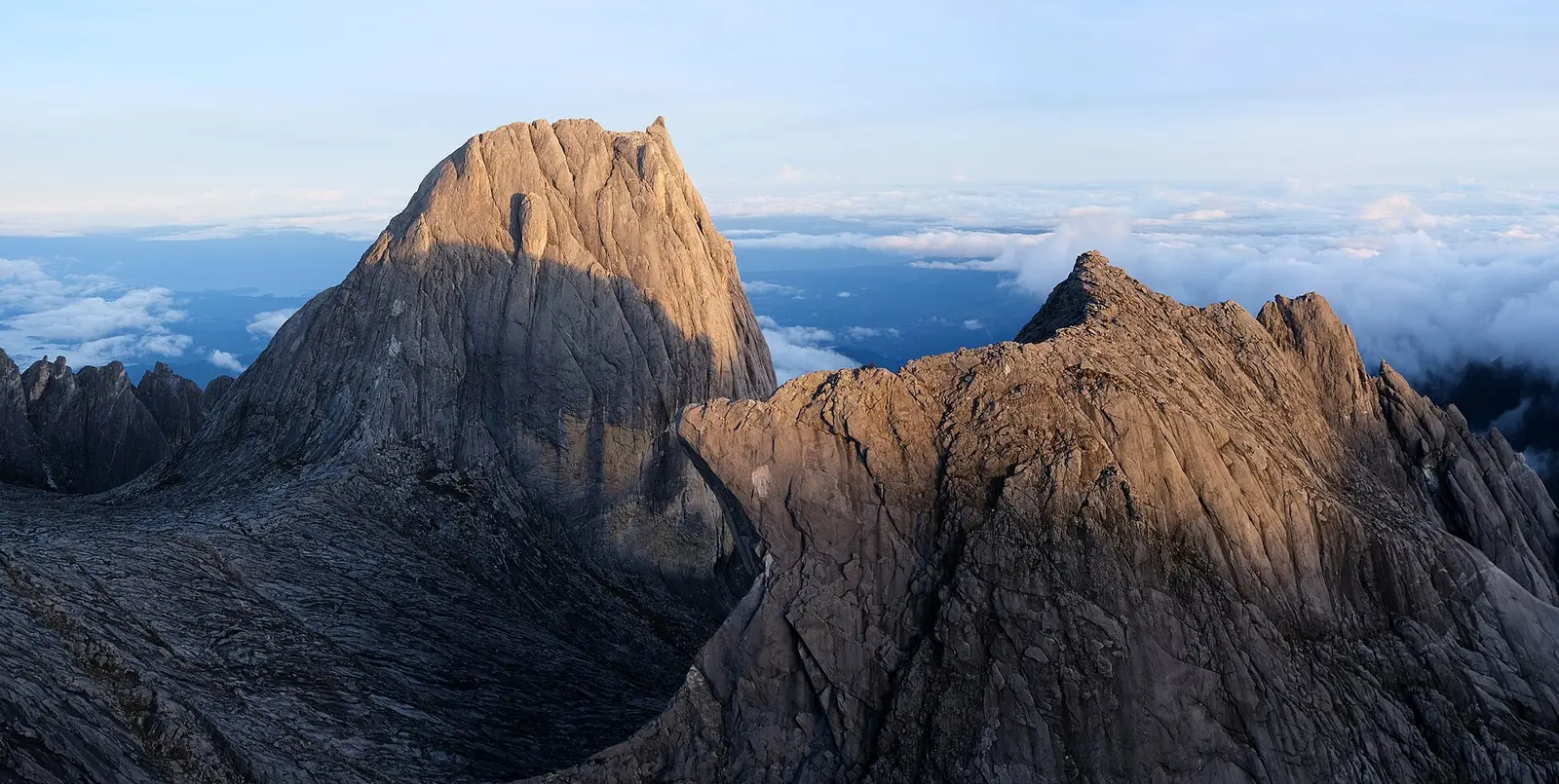 Victoria Peak and granite summit ridge of Mount Kinabalu above the clouds