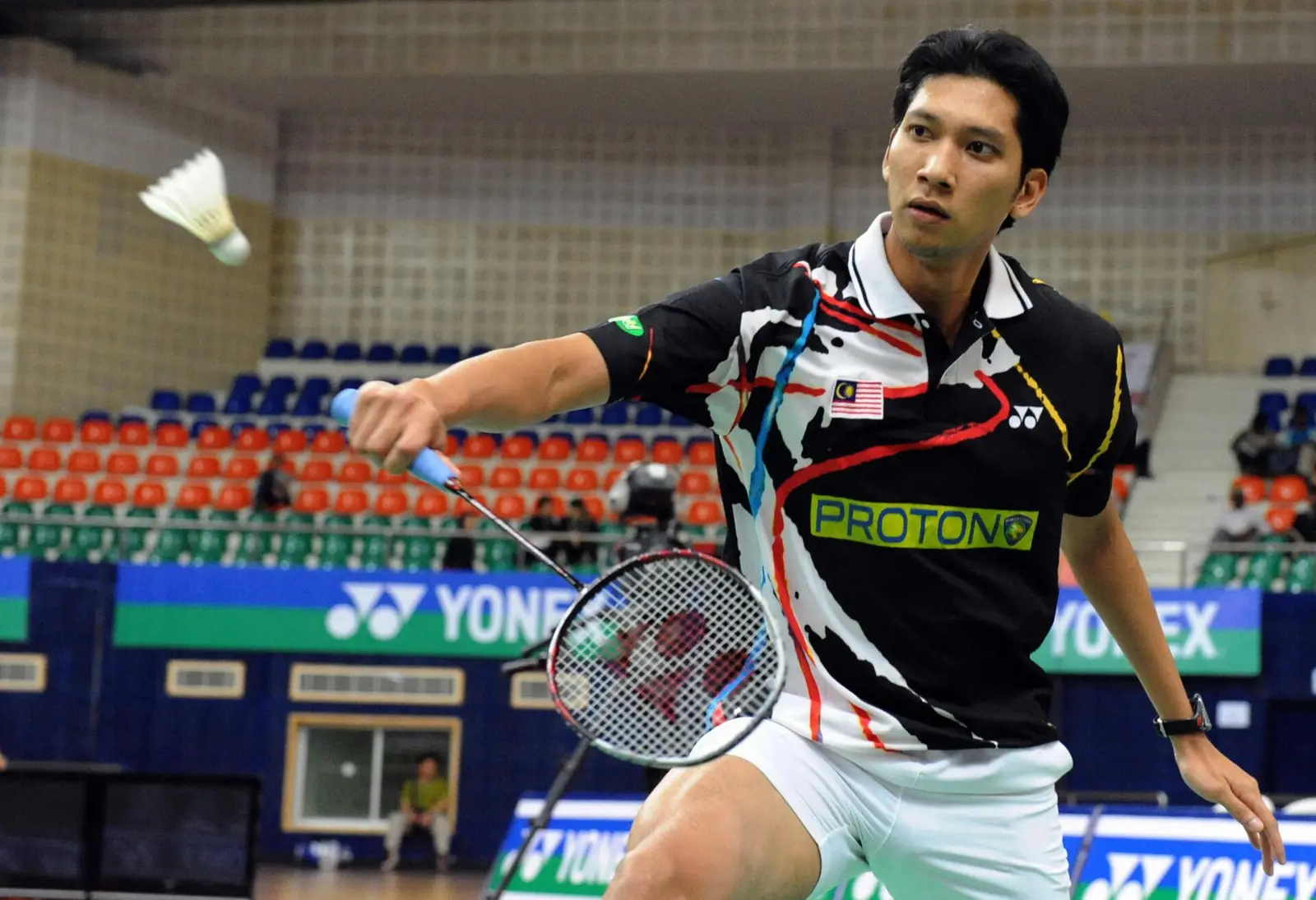 A Malaysian player lunging for a shot during the 2008 Malaysia Open badminton championships