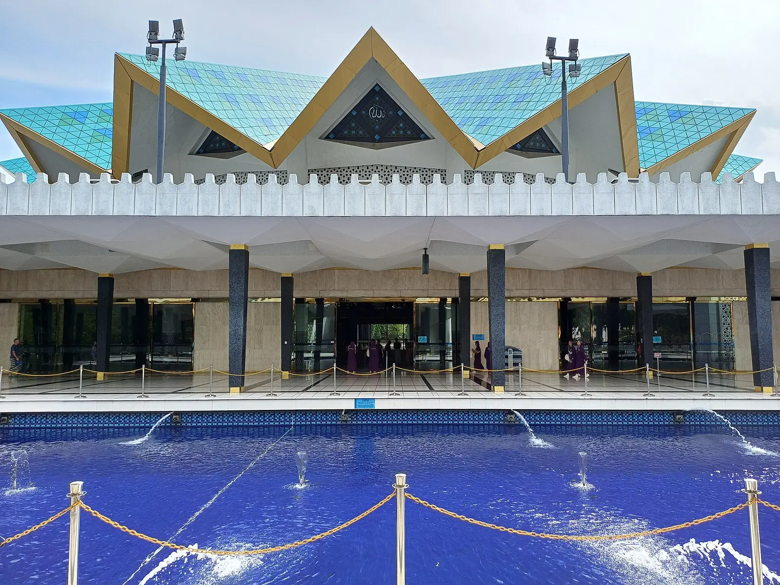 Entrance and reflecting pool of Masjid Negara, the National Mosque of Malaysia in Kuala Lumpur